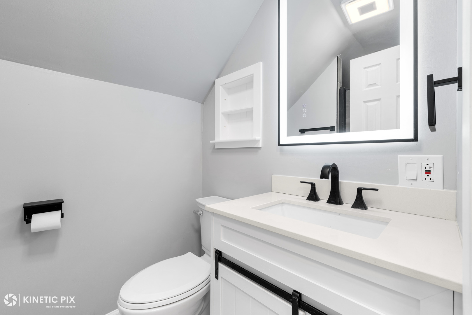 1412 West Broadview Avenue Crete, IL 60417 - Photo 19 of 28 a bathroom with a sink a toilet and mirror
