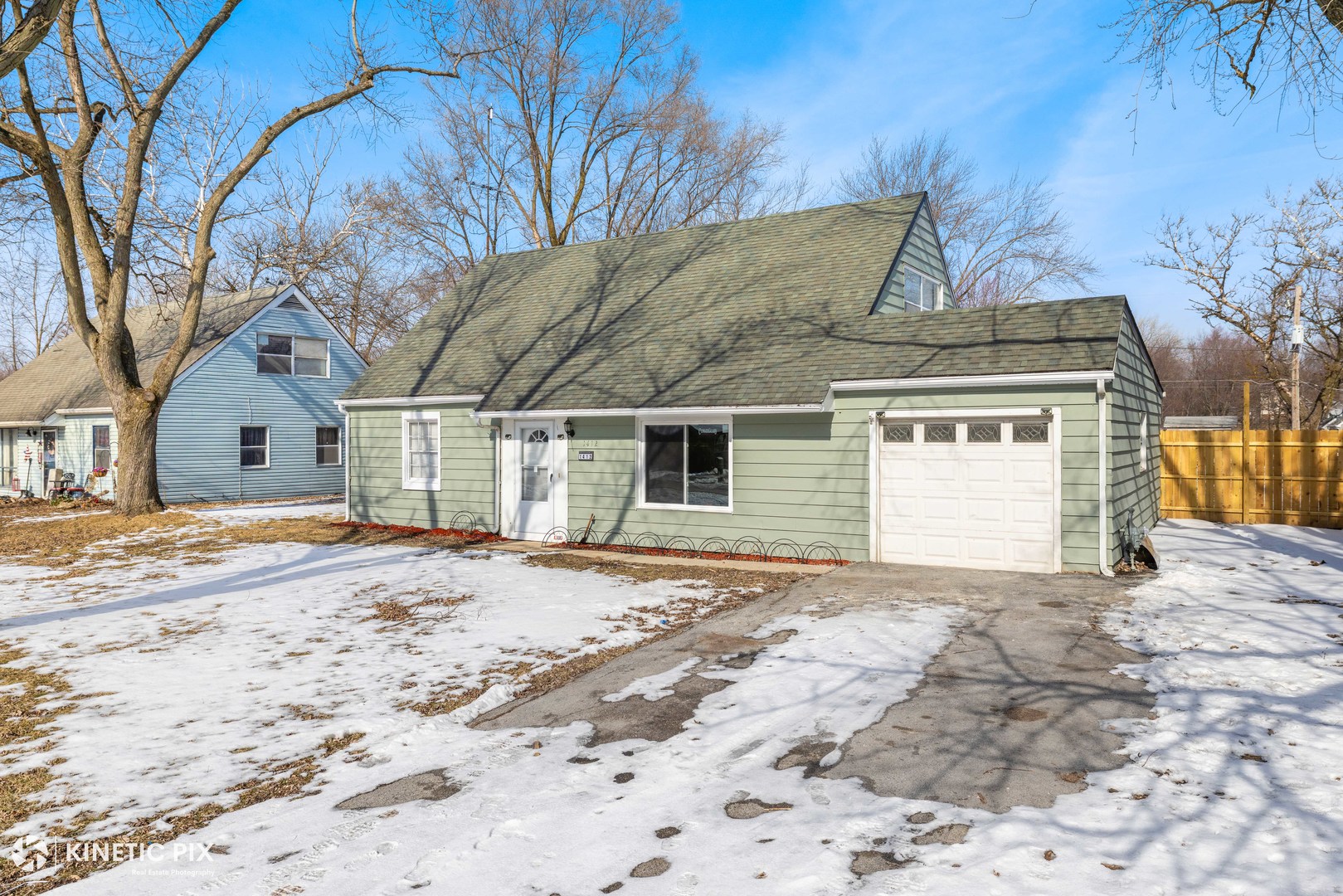1412 West Broadview Avenue Crete, IL 60417 - Photo 2 of 28 a view of a house with a snow in the yard