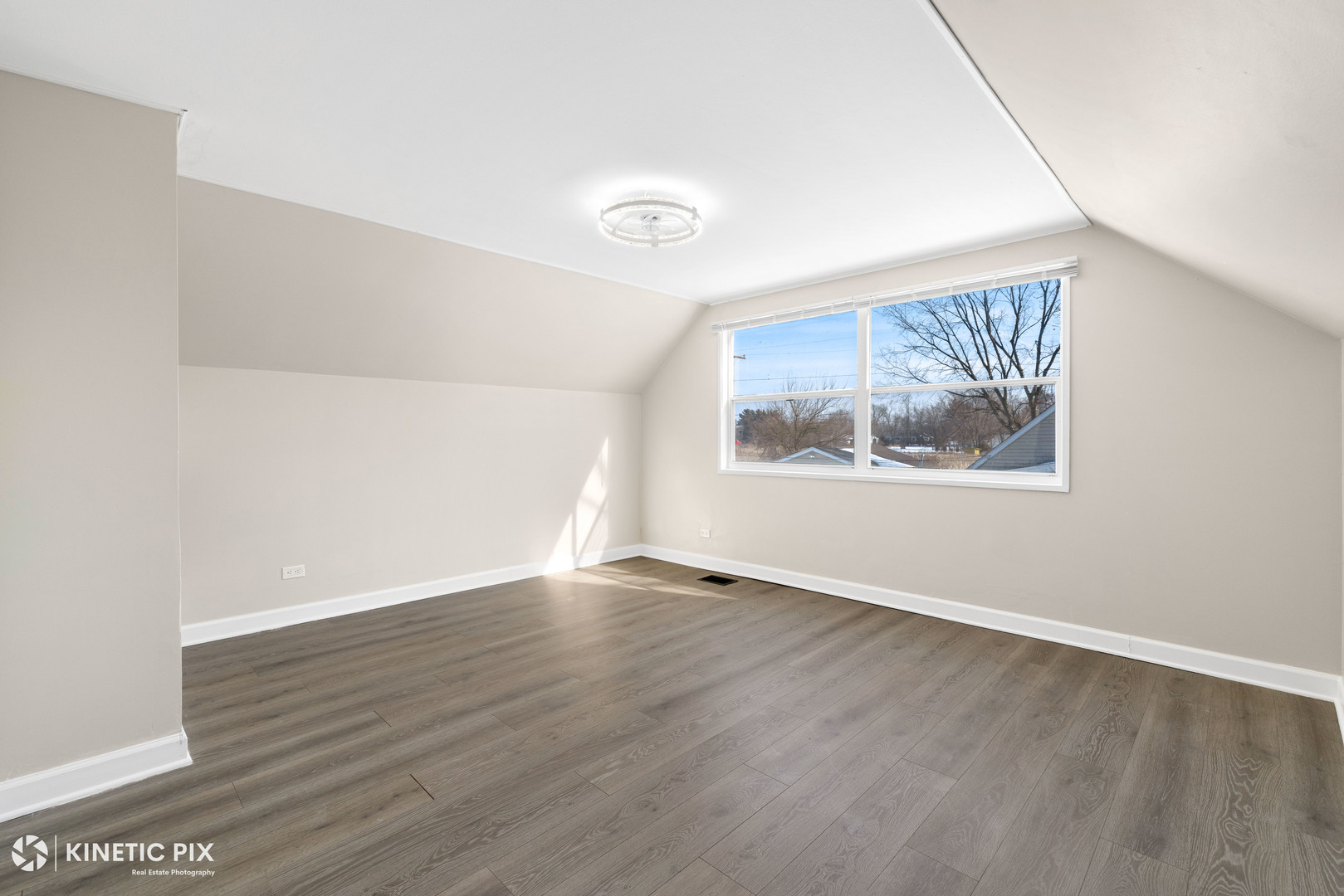 1412 West Broadview Avenue Crete, IL 60417 - Photo 21 of 28 an empty room with wooden floor and window
