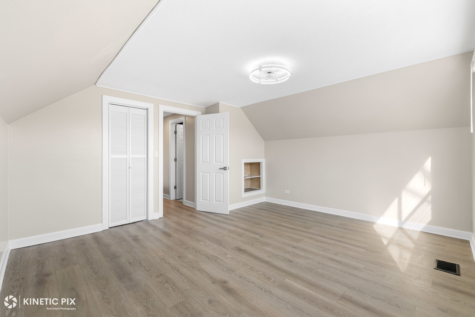 1412 West Broadview Avenue Crete, IL 60417 - Photo 22 of 28 an empty room with wooden floor and windows