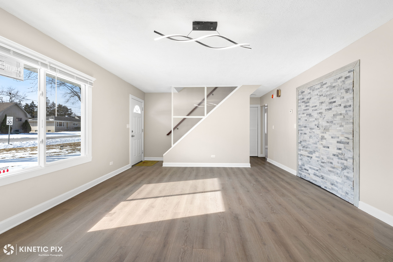 1412 West Broadview Avenue Crete, IL 60417 - Photo 5 of 28 a view of an empty room with wooden floor and a window