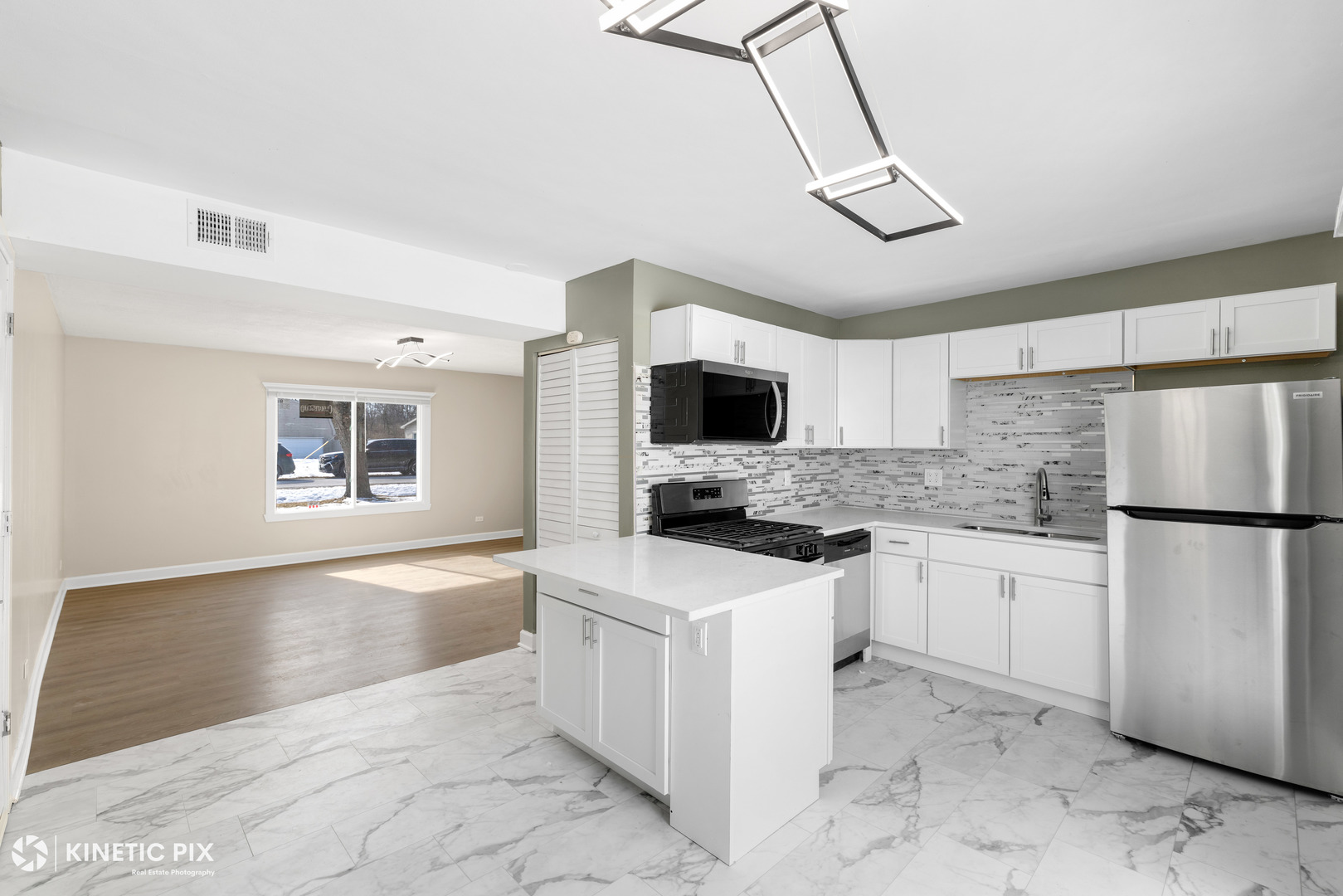 1412 West Broadview Avenue Crete, IL 60417 - Photo 9 of 28 a kitchen with white cabinets and white appliances