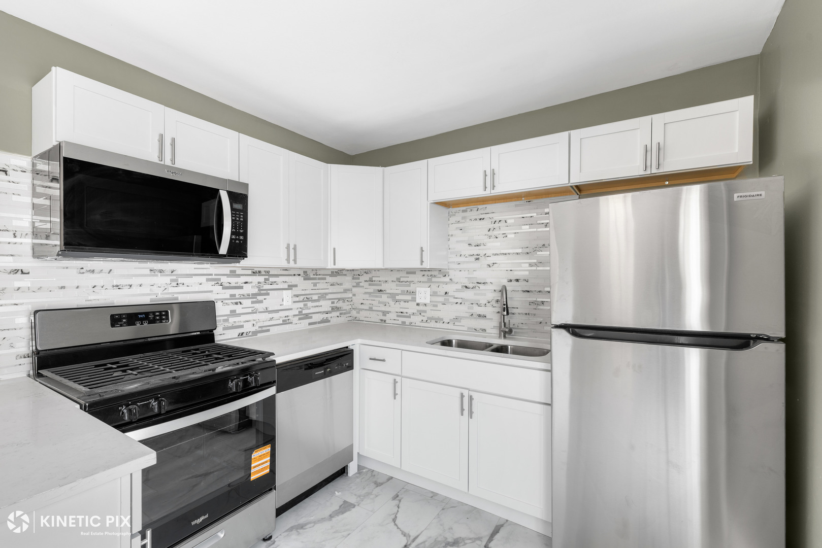 1412 West Broadview Avenue Crete, IL 60417 - Photo 10 of 28 a kitchen with a refrigerator stove and microwave