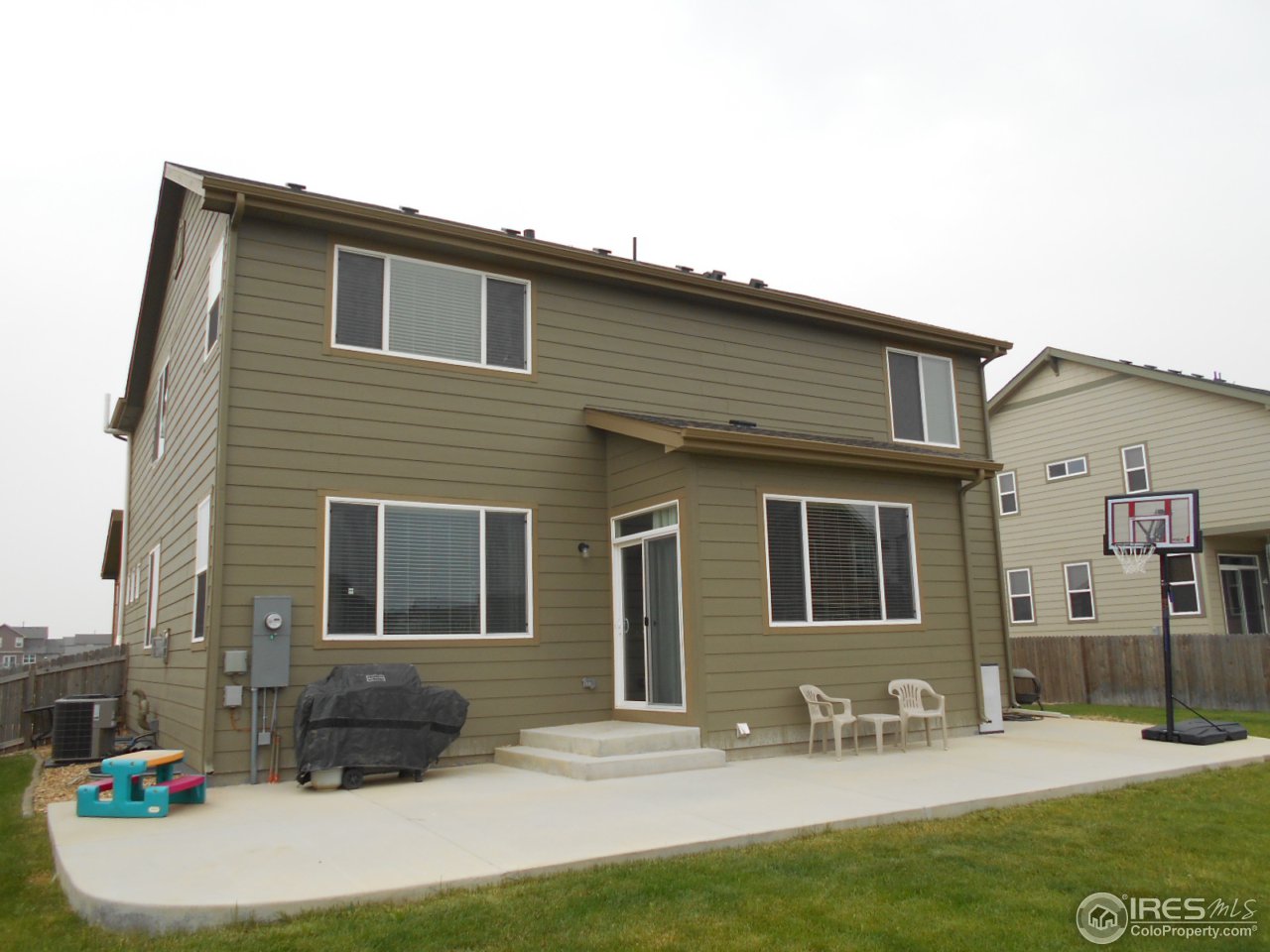 4389 Bramble Road Frederick, CO 80504 - Photo 3 of 25 a front view of a house with outdoor seating