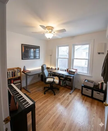a living room with furniture a fireplace and a window