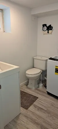 a bathroom with a toilet and a sink