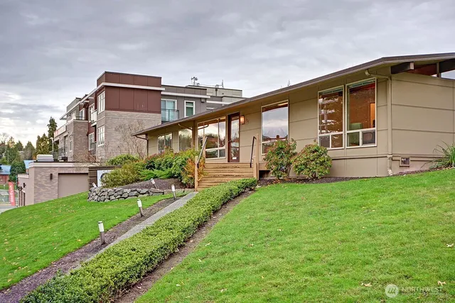 a front view of a house with garden