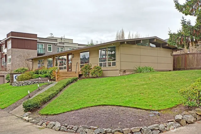 a front view of a house with garden