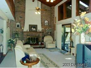 14 Remington Road Ormond Beach, FL 32174 - Photo 5 of 8 a living room with furniture and a fireplace