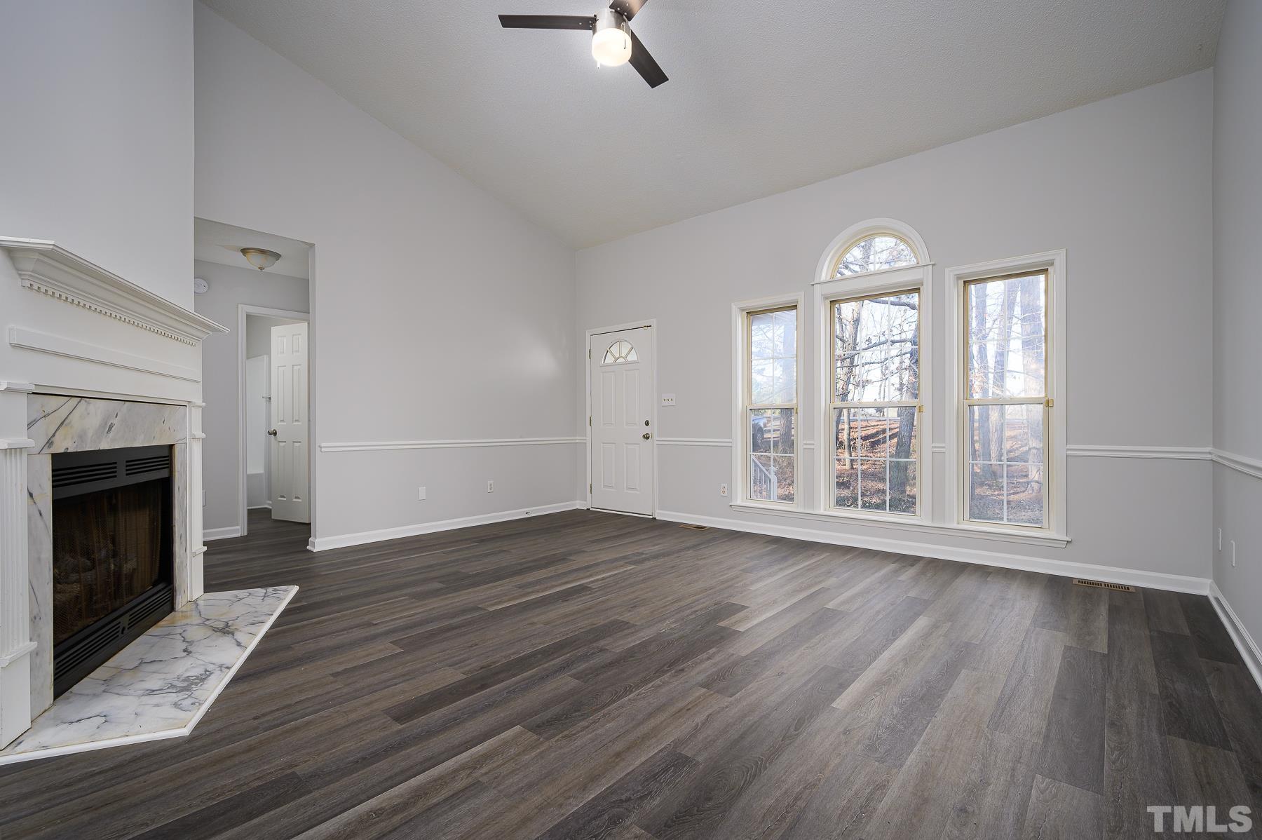 1500 Edgemont Road Wendell, NC 27591 - Photo 3 of 20 wooden floor fireplace and windows in an empty room
