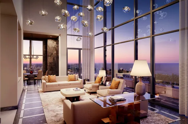 a living room with furniture fireplace and a large window