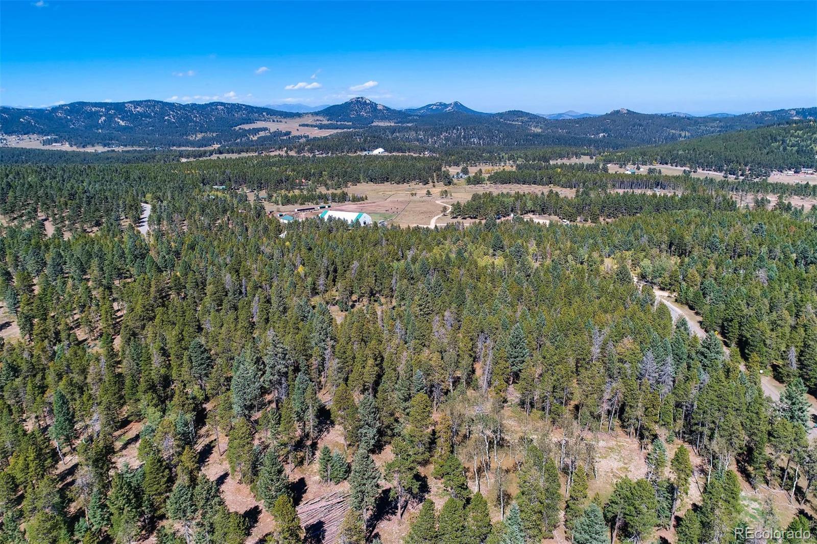 12171 South Ridge Road Conifer, CO 80433 - Photo 4 of 11 a view of lake and mountain