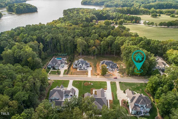 an aerial view of a house with garden space lake view and lake view