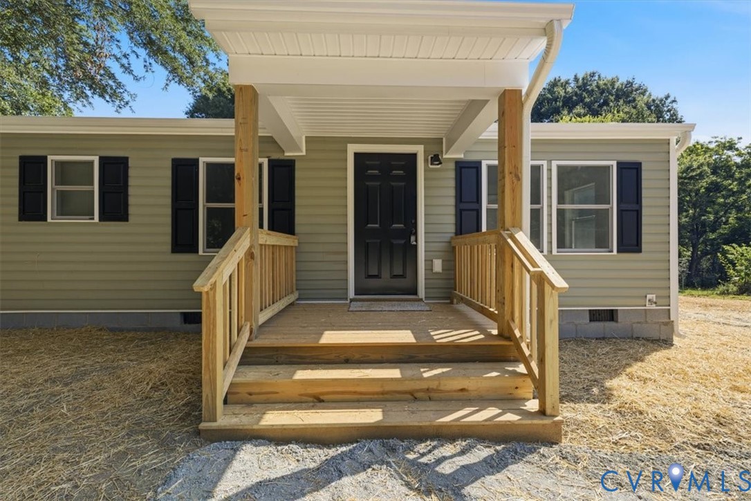 15221 Wright Road Amelia Court House, VA 23002 - Photo 2 of 22 Front porch with natural wood railings and steps