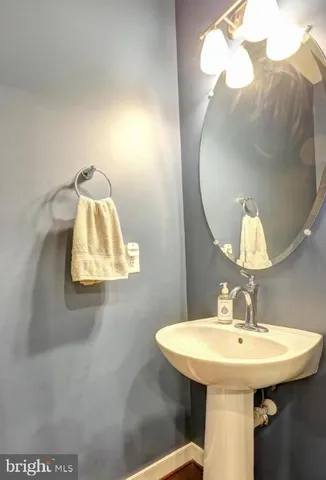 a bedroom with a bed a dresser and a window