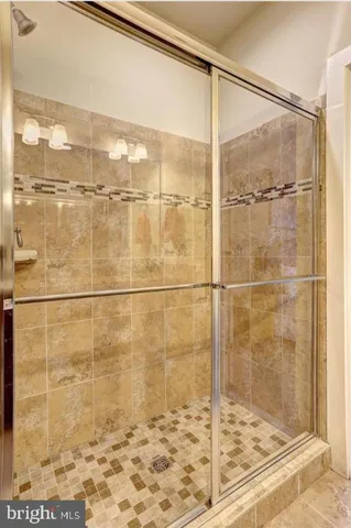 a view of walk in closet with clothes