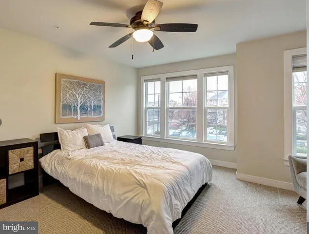 a spacious bedroom with a bed and a couch