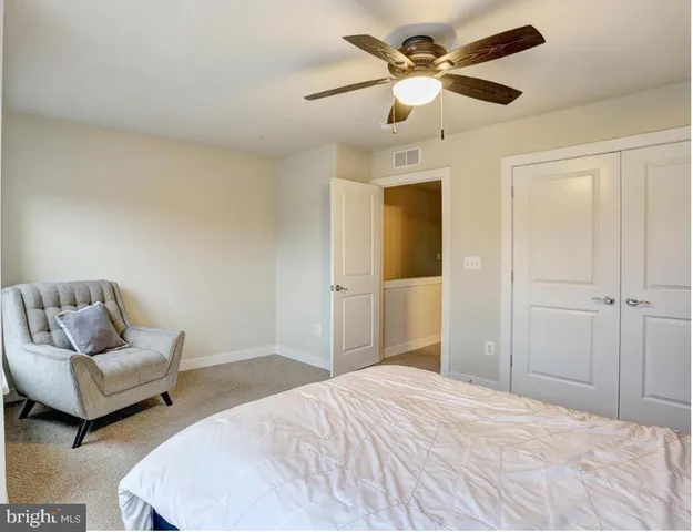 a bathroom with a toilet a sink and a mirror