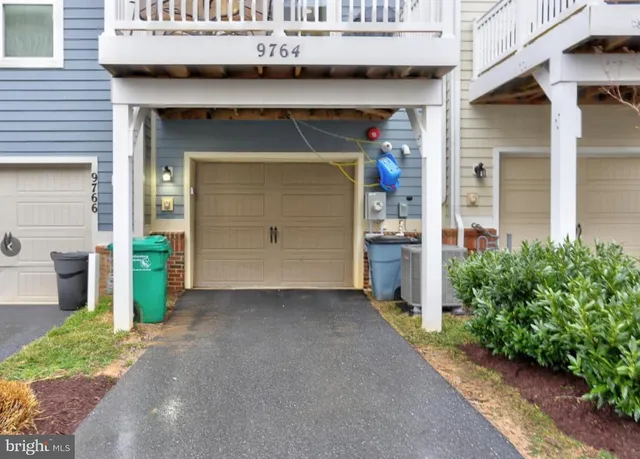 a view of a park with iron fence