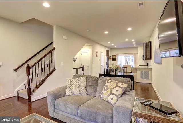a view of a dining room with furniture window and wooden floor
