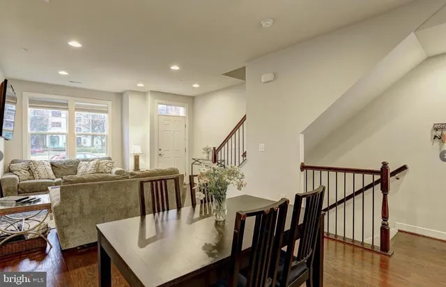 a kitchen with stainless steel appliances granite countertop a refrigerator a sink and a stove