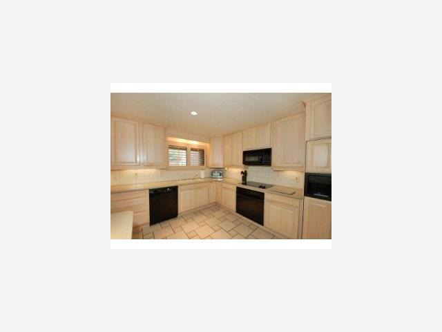 22971 Longdown Road Cupertino, CA 95014 - Photo 2 of 9 a kitchen with granite countertop a stove top oven