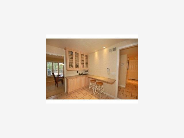 22971 Longdown Road Cupertino, CA 95014 - Photo 6 of 9 a bathroom with a sink mirror and a bath tub