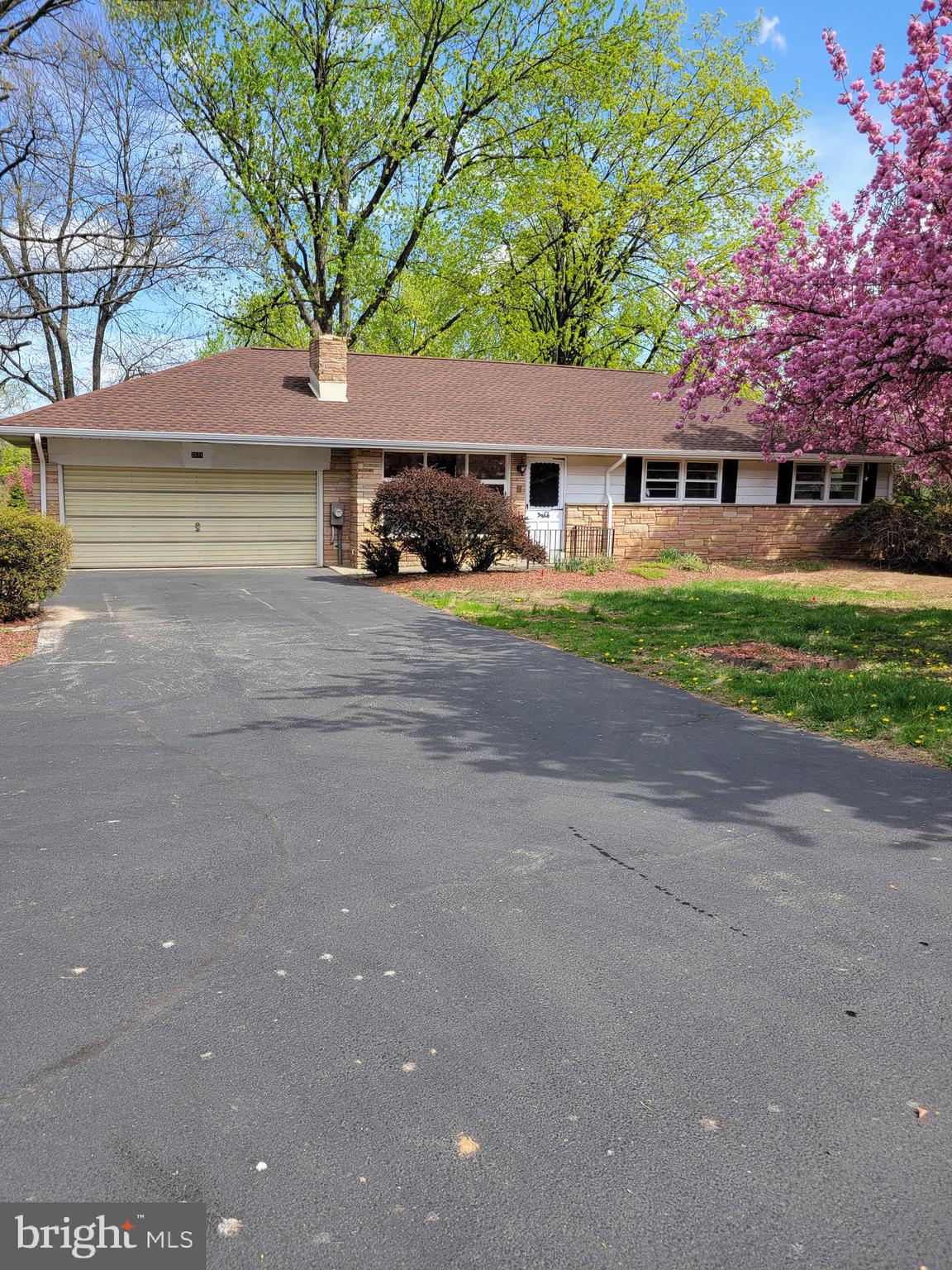 2671 Egypt Road Audubon, PA 19403 - Photo 1 of 25 a front view of a house with a yard and garage