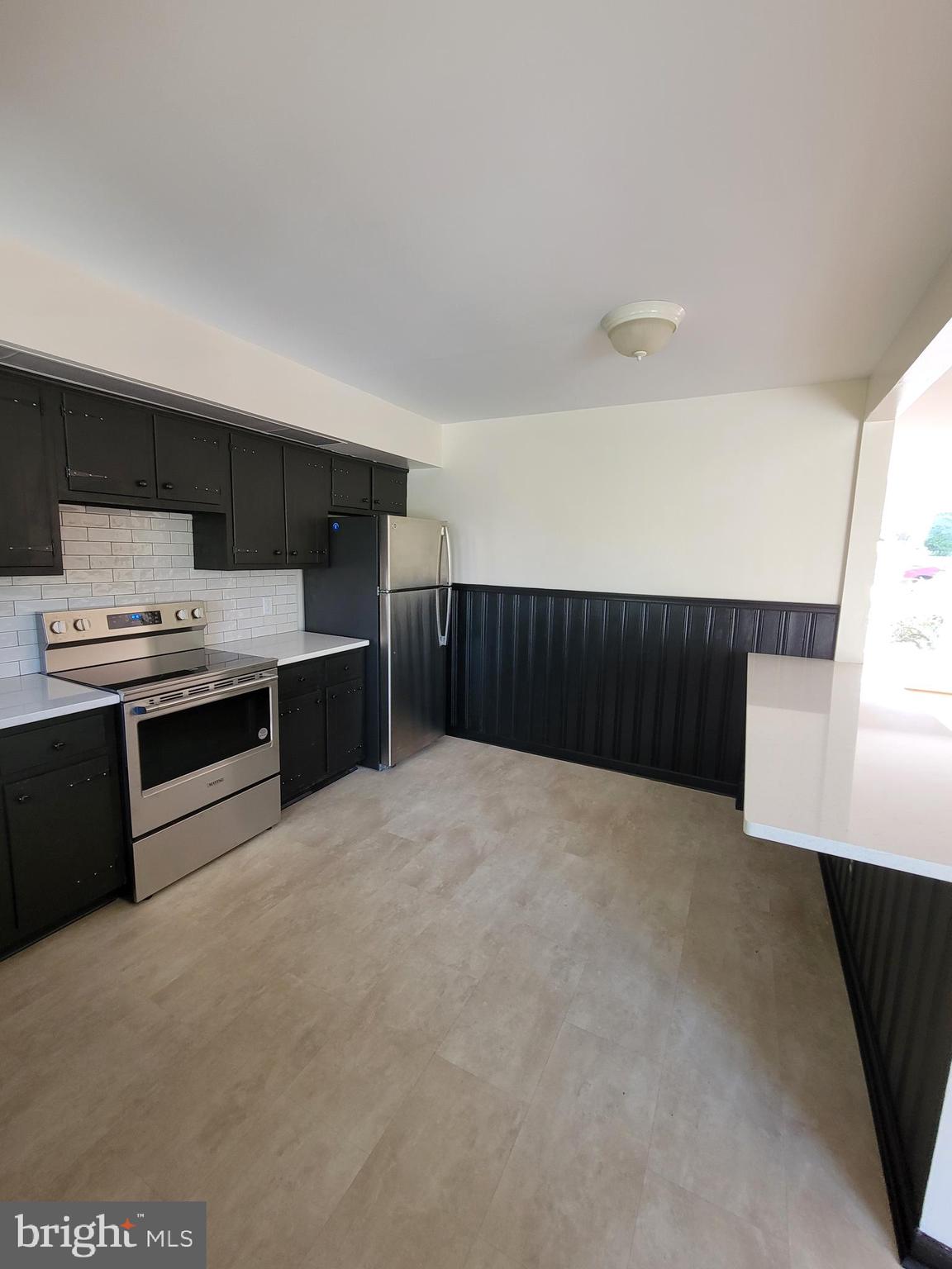 2671 Egypt Road Audubon, PA 19403 - Photo 5 of 25 a kitchen with stainless steel appliances a refrigerator and a stove top oven