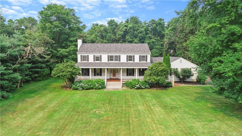 219 West Norwalk Road Norwalk, CT 06850 - Photo 1 of 1 a front view of a house with a yard