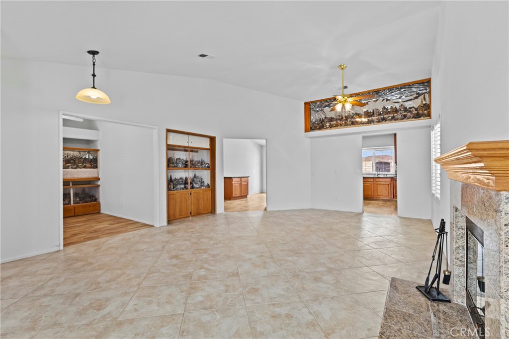27126 Rio Vista Drive Menifee, CA 92586 - Photo 14 of 47 a view of an empty room with a fireplace