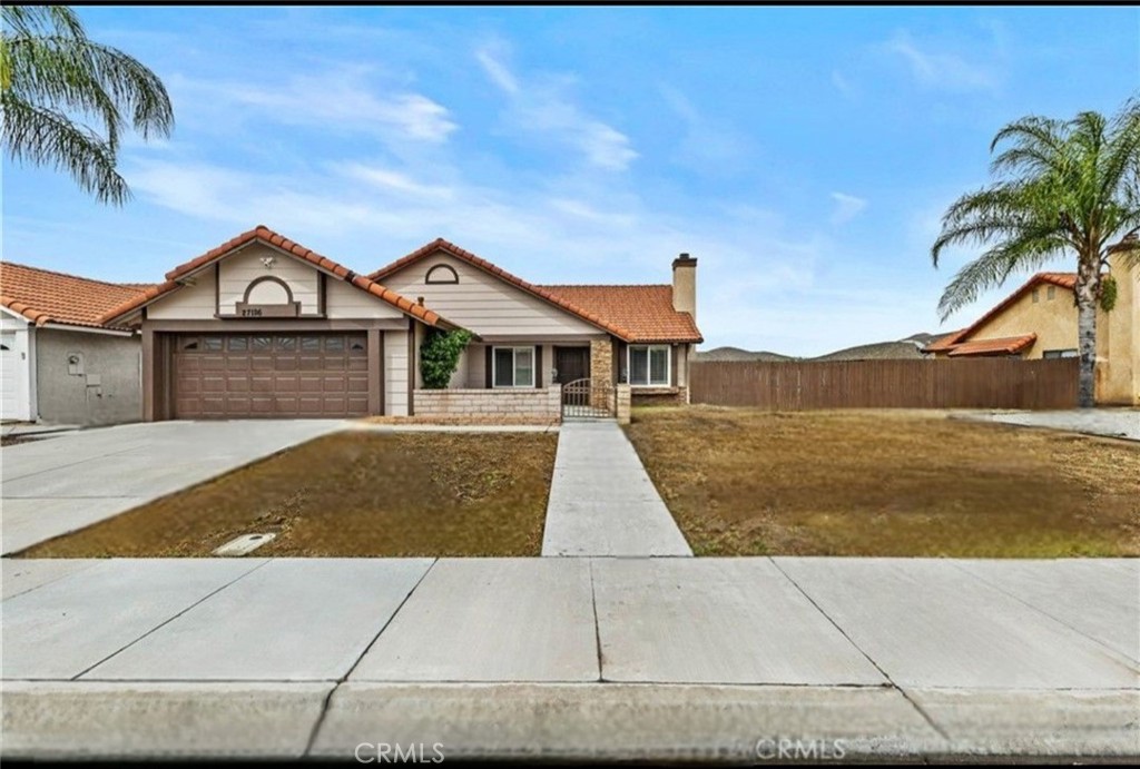 27126 Rio Vista Drive Menifee, CA 92586 - Photo 7 of 47 a front view of a house with a garden