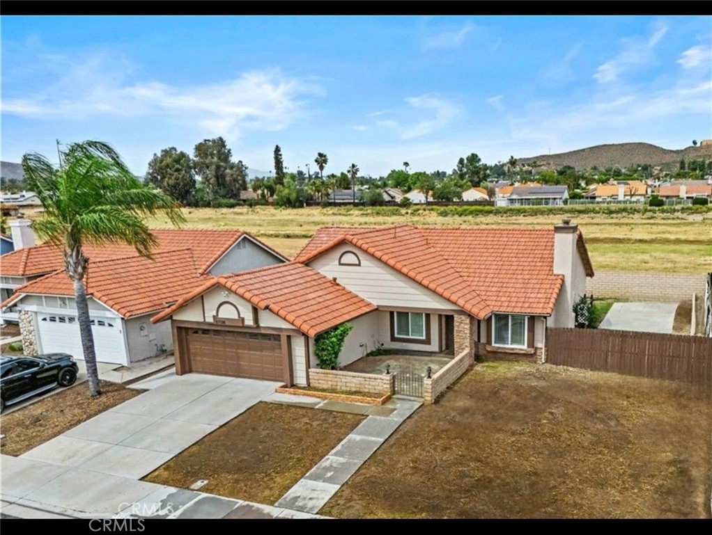 27126 Rio Vista Drive Menifee, CA 92586 - Photo 8 of 47 a aerial view of a house with a yard and sitting area