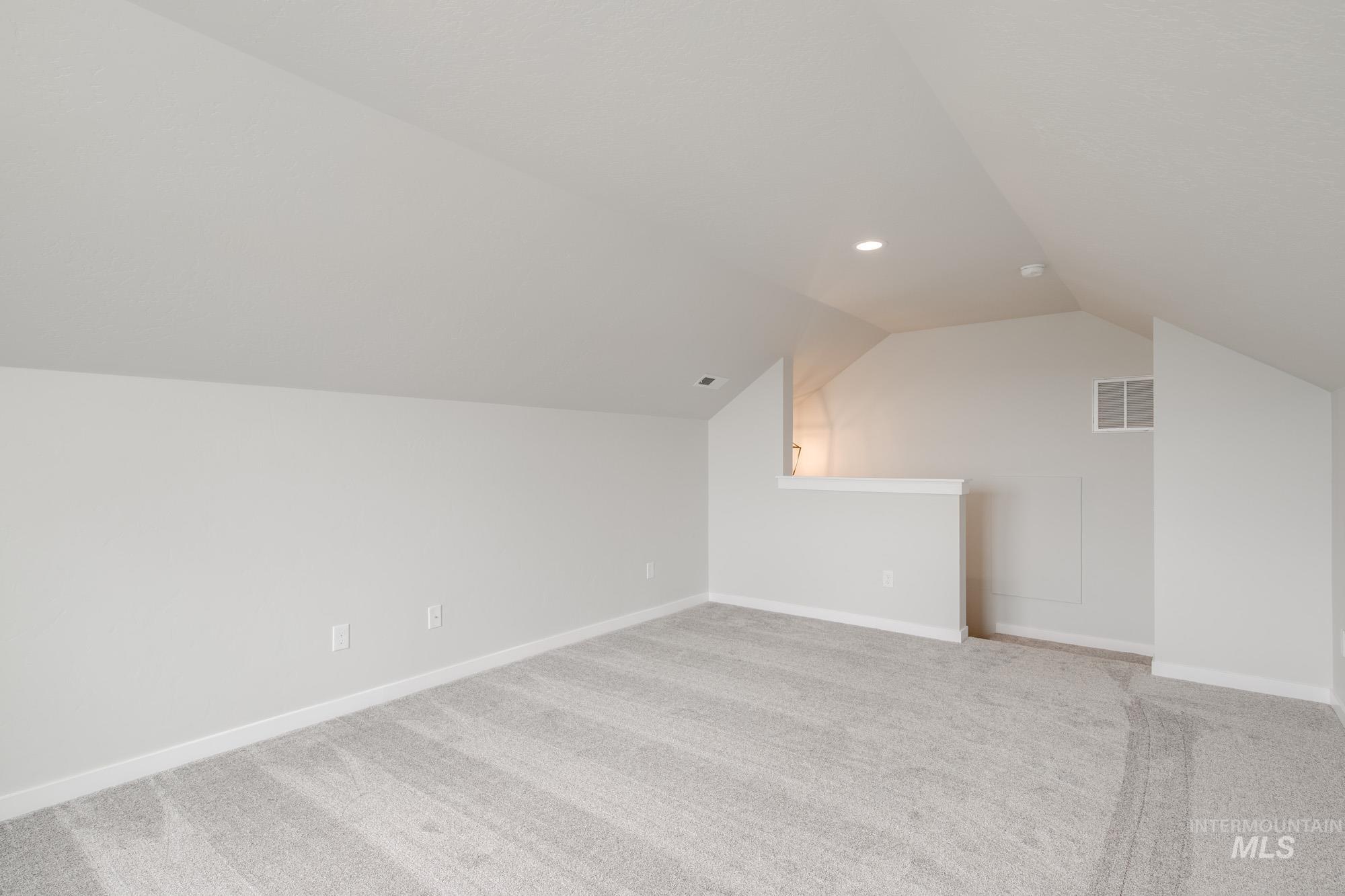 5261 South Memory Avenue Meridian, ID 83642 - Photo 23 of 30 Additional living space with light carpet and recessed lighting