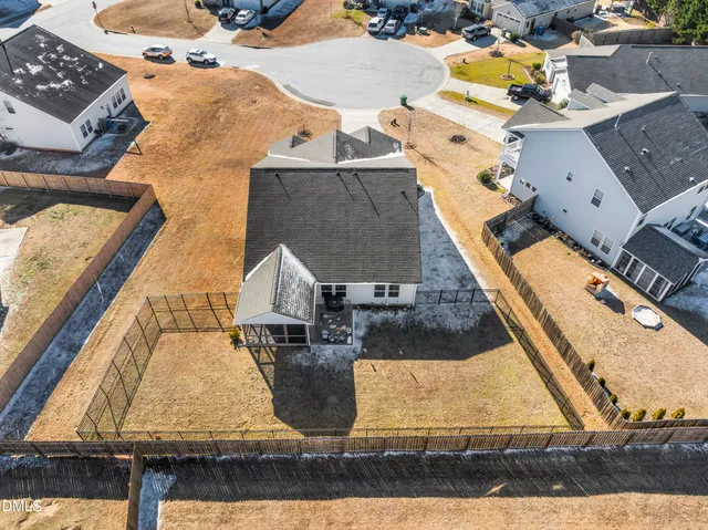 an aerial view of residential houses with outdoor space