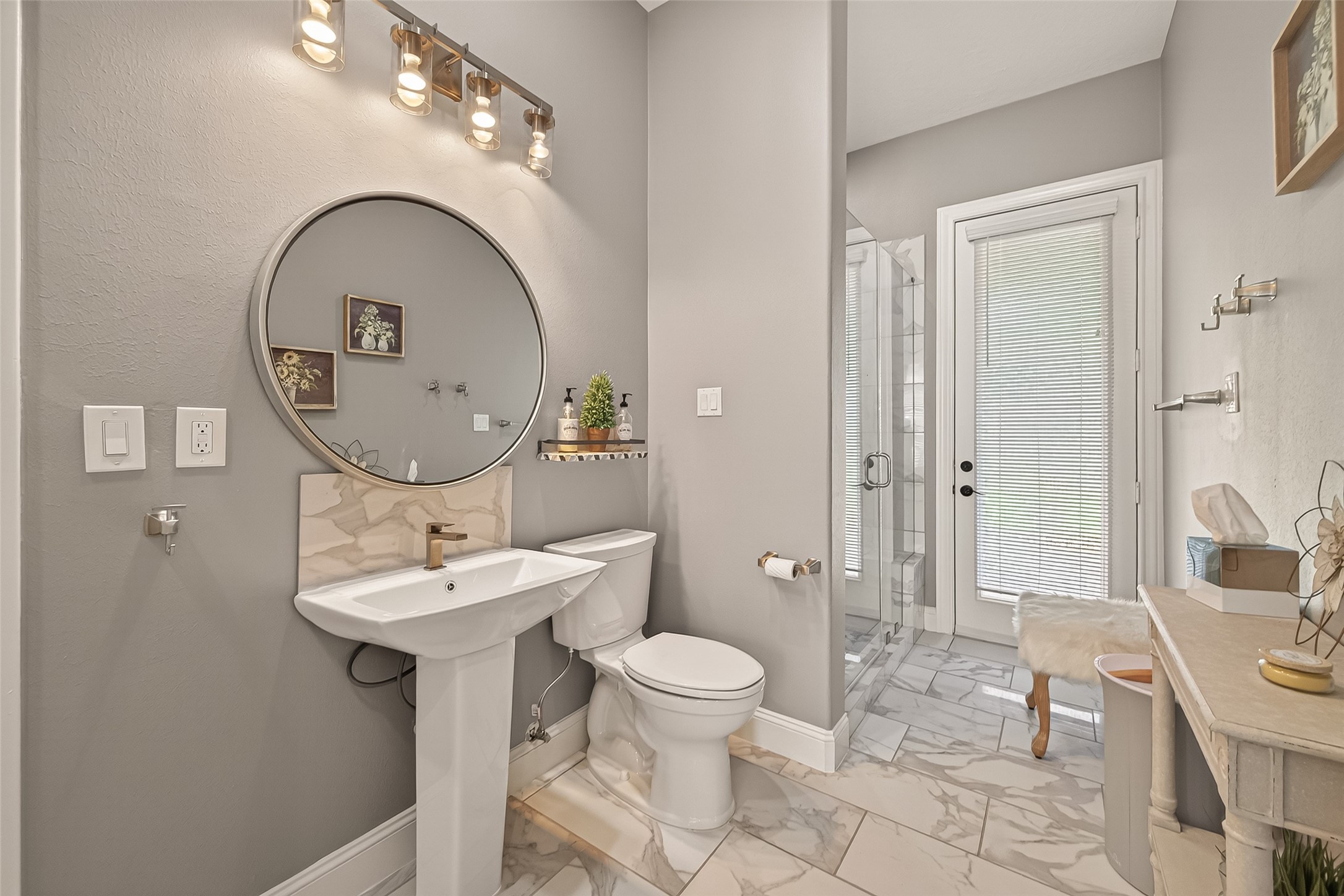 2319 Braer Ridge Drive Katy, TX 77494 - Photo 18 of 50 a bathroom with a toilet sink and mirror