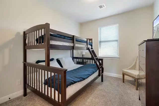 a bedroom with furniture and window