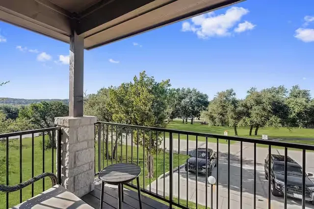a view of a balcony with chairs