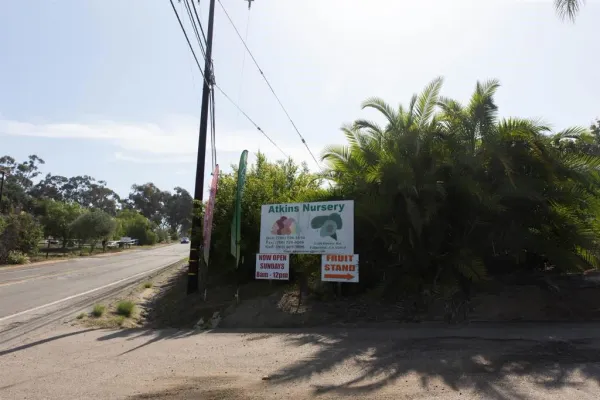 a sign board with a yard