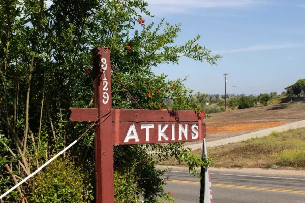 a view of a sign board with street