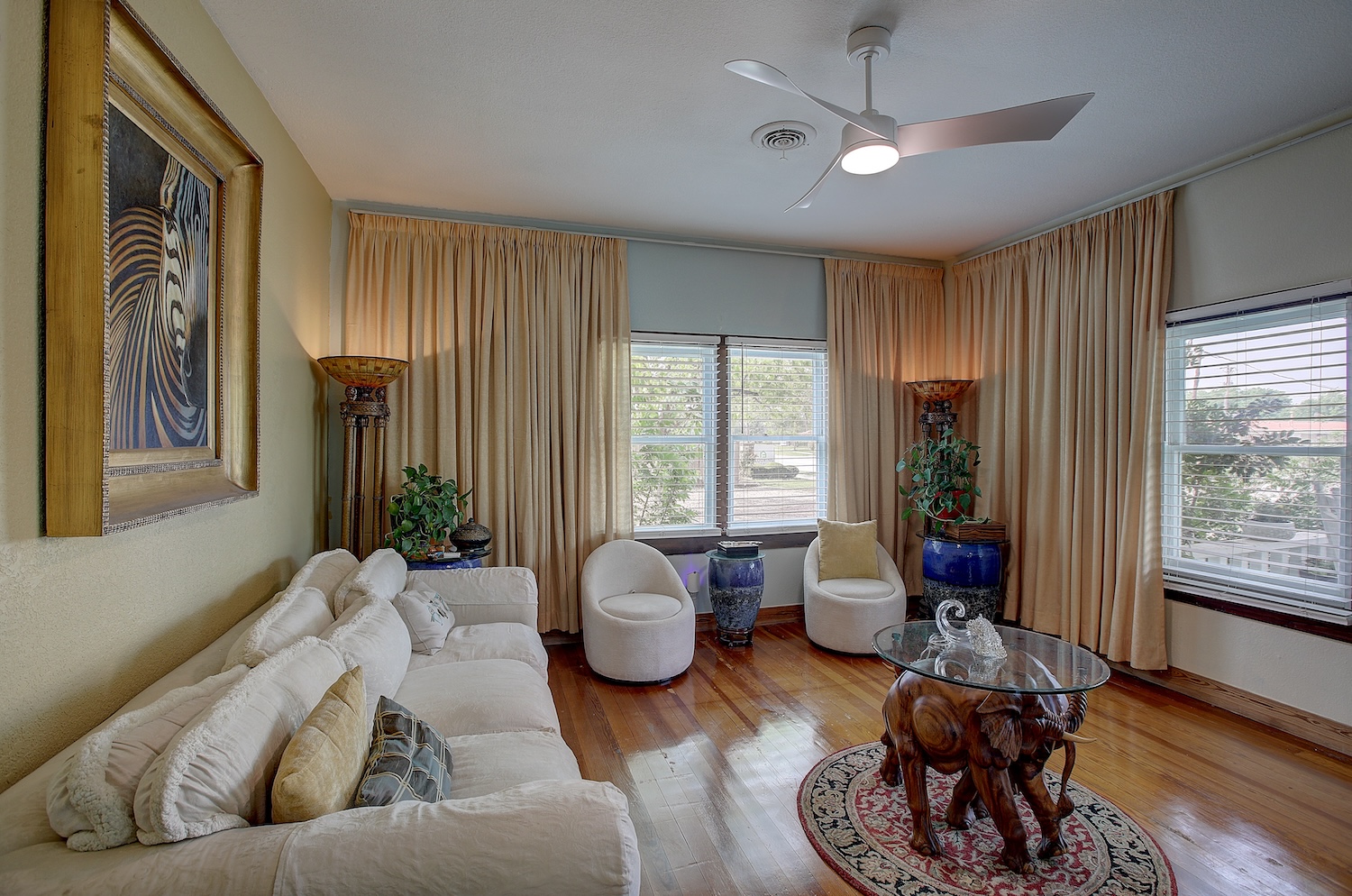 1903 South Austin Avenue Georgetown, TX 78626 - Photo 2 of 40 Welcome to the den/TV room. Was previously a bedroom, but has been opened into the living room for grand open spaces for relaxing or entertaining. Blinds convey, Draperies do not.