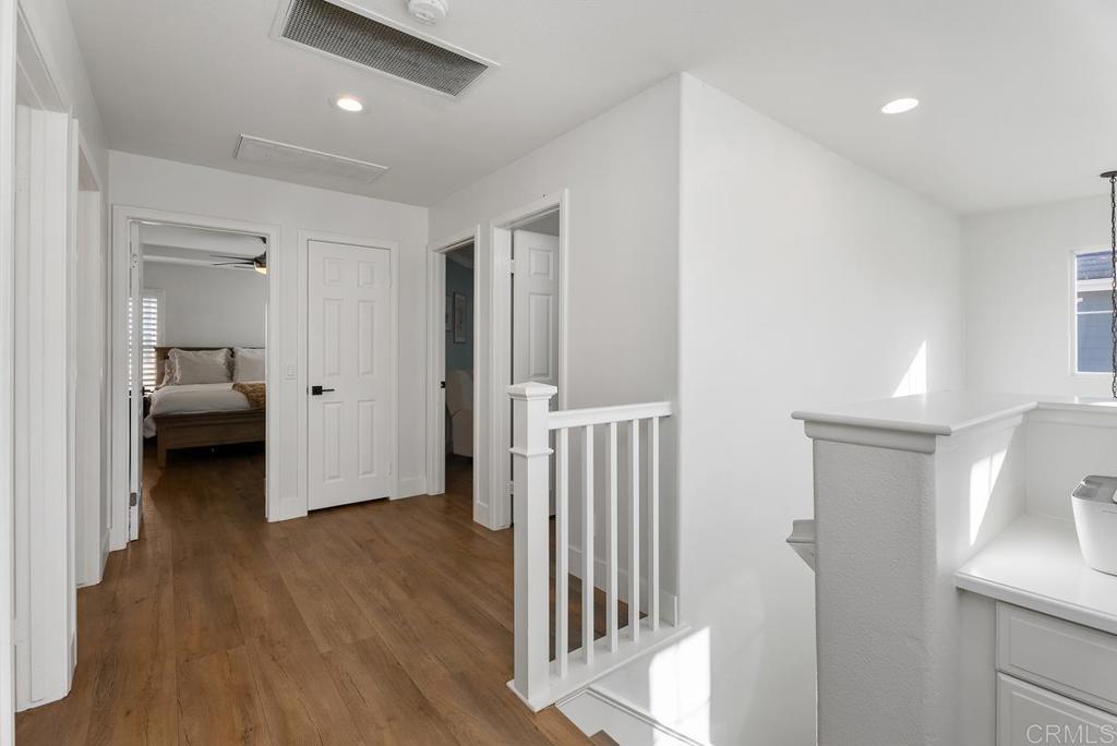 8 Potters Bend Ladera Ranch, CA 92694 - Photo 12 of 42 a view of a hallway with wooden floor and a sink