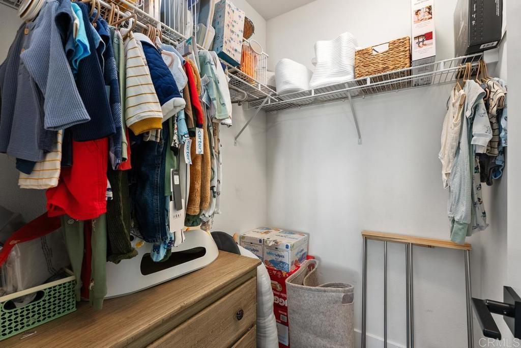 8 Potters Bend Ladera Ranch, CA 92694 - Photo 19 of 42 a view of walk in closet with clothes and shoes