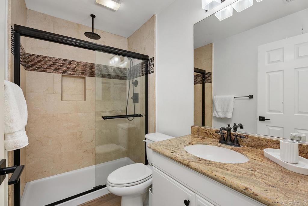 8 Potters Bend Ladera Ranch, CA 92694 - Photo 23 of 42 a bathroom with a granite countertop sink toilet and shower