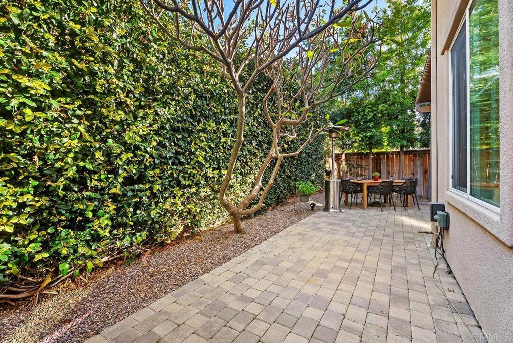 8 Potters Bend Ladera Ranch, CA 92694 - Photo 27 of 42 a view of a patio with table and chairs and potted plants