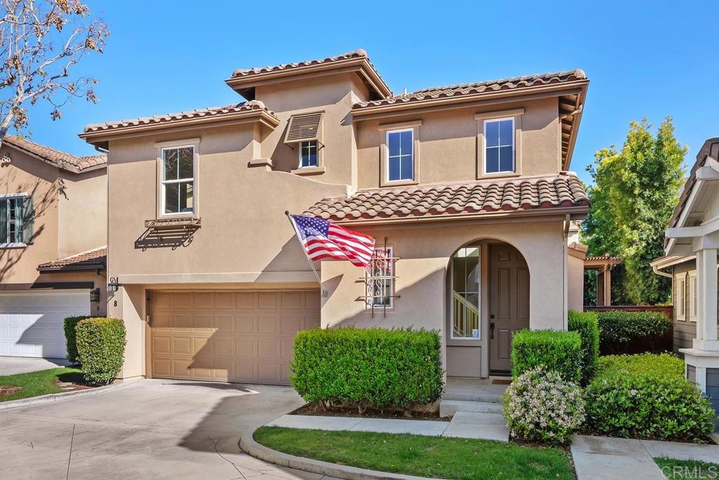 8 Potters Bend Ladera Ranch, CA 92694 - Photo 30 of 42 a front view of a house with a yard and garage