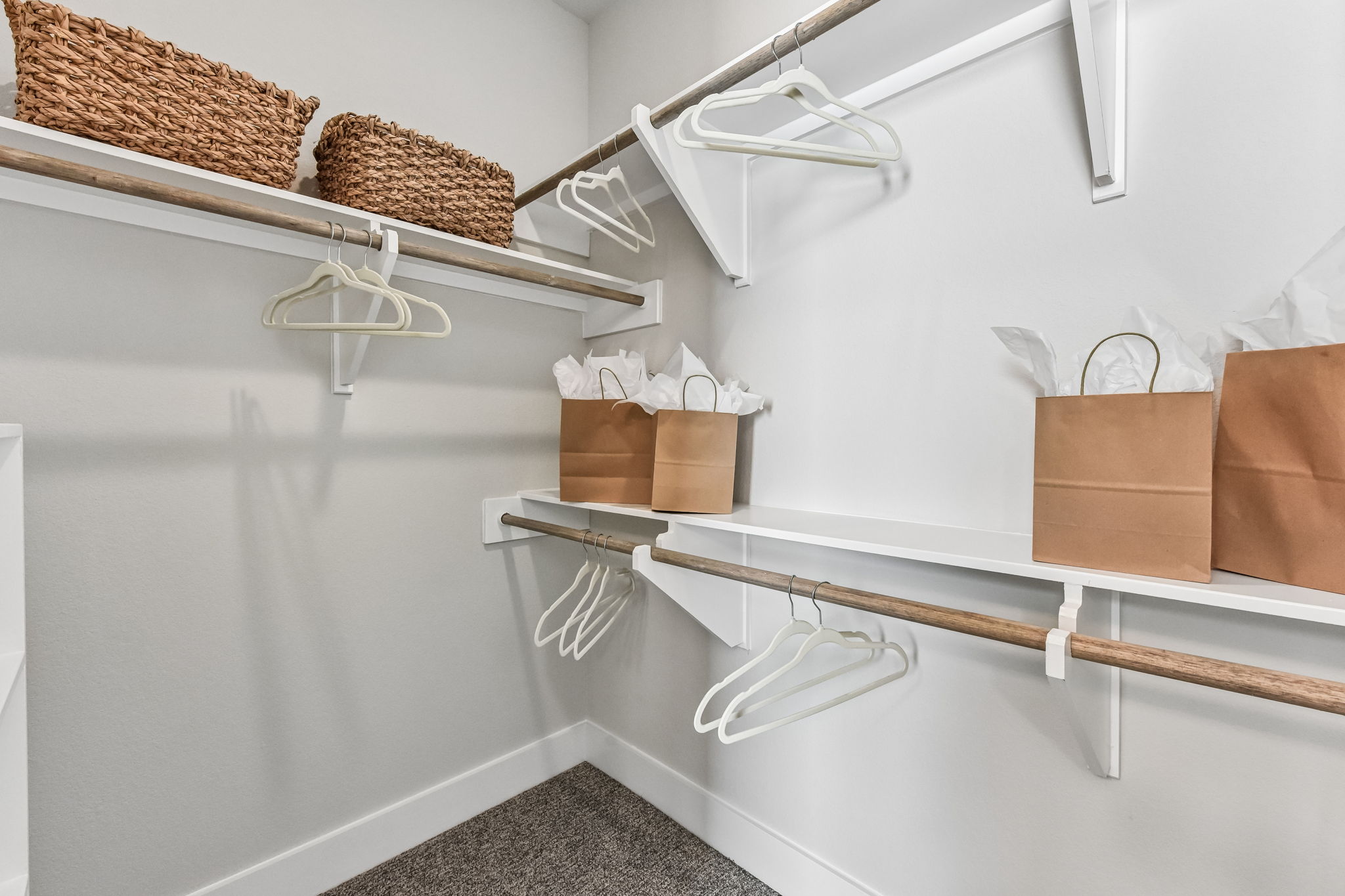 9101 Cattle Baron Path Austin, TX 78747 - Photo 26 of 40 An organized closet featuring ample shelving and hanging rods.