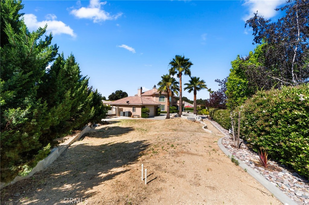 38136 Butterfly Court Yucaipa, CA 92399 - Photo 25 of 71 a view of a houses with a yard