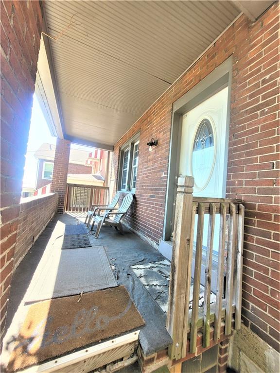 263 Robinson Street Pittsburgh, PA 15213 - Photo 21 of 21 a view of a porch with a table and chairs and floor to ceiling window