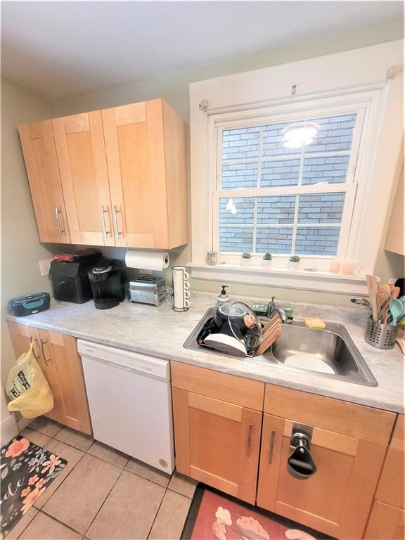 263 Robinson Street Pittsburgh, PA 15213 - Photo 8 of 21 a kitchen with a sink a window and cabinets